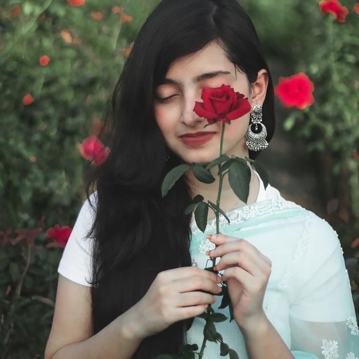 Alex Morgan, Lead Design Curator at Frosted Peak Network, reviewing corporate floral arrangements
